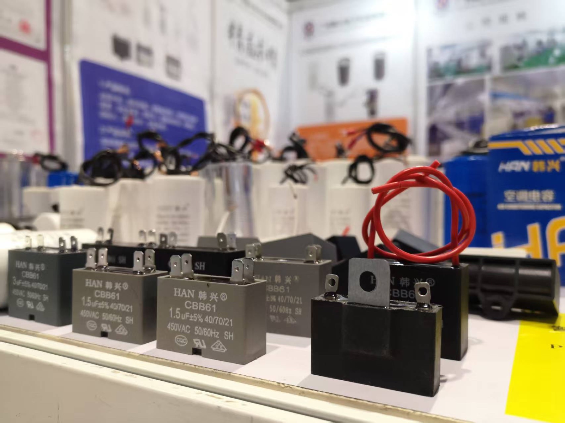 HAN XING CBB61 rectangular fan capacitors on display